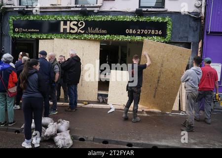 The clean up gets underway on Main street in Midleton, Co Cork, after extensive damage caused by flooding following Storm Babet, the second named storm of the season, swept in. Picture date: Thursday October 19, 2023. Stock Photo