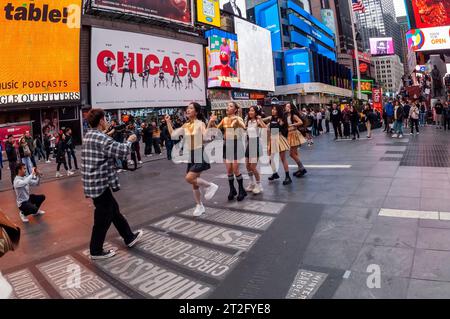 A videographer films dancers in Times Square in New York on Sunday, October 15, 2023. (© Richard B. Levine) Stock Photo