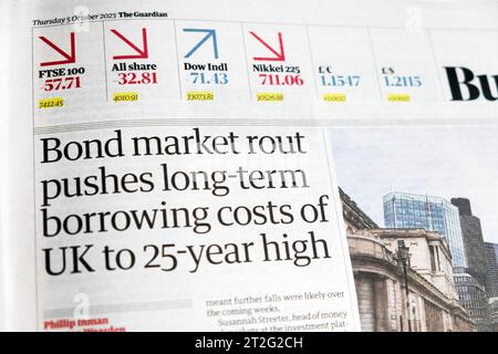 'Bond market rout pushes long-term borrowing costs of UK to 25 year high' Guardian newspaper headline Business section article 5 October 2023 London Stock Photo