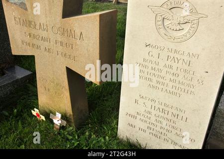 Headstones of Polish Air Force pilot S Osmala,RAF Sgts G L Payne and R S Hartnell killed in World War Two, at St Patrick's Church, Jurby, Isle of Man. Stock Photo