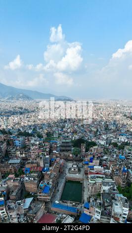 Aerial view of  Bagh Bhairab Temple, Kirtipur, hills, Kathmandu, palaces and buildings. Terraces and homes, city streets. Nepal. 10-13-2023 Stock Photo