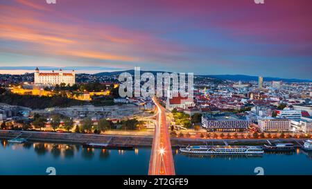 Bratislava, Slovakia. Aerial cityscape image of Bratislava, capital city of Slovakia during beautiful autumn sunset. Stock Photo