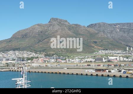 Devil's Peak, in Afrikaans Duiwelspiek as part of the mountainous backdrop to Cape Town is observed from the port. Stock Photo