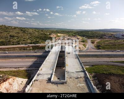 Road and train rail near Ishpro center in Modiin, Israel - drone footage. Stock Photo