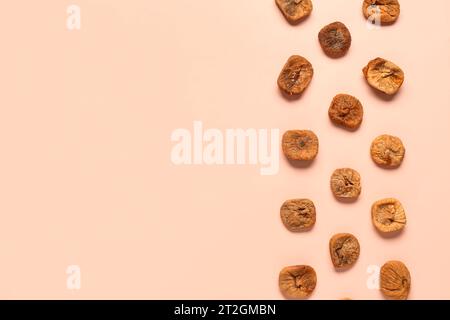 Sweet dried figs on orange background Stock Photo