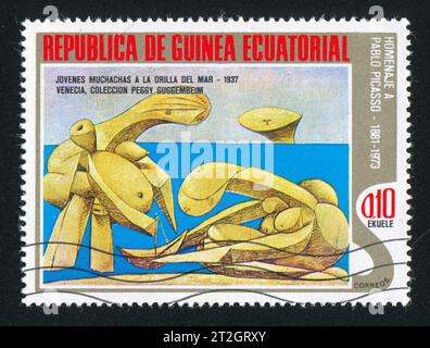 EQUATORIAL GUINEA - CIRCA 1976: stamp printed by Equatorial Guinea, shows Young Girls at the Seaside by Chavannes, circa 1976 Stock Photo