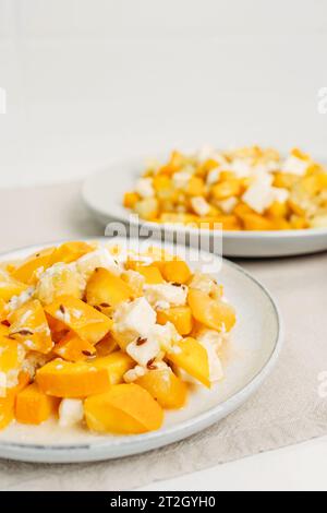 A dietary dish made from zucchini and feta cheese. Close-up. View from above. Keto diet. Vertical frame. Stock Photo
