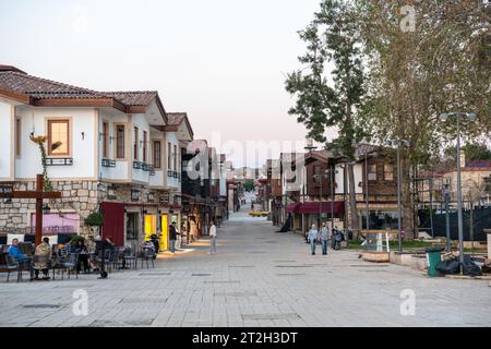 Side, Antalya, Turkey – March 25, 2023. Main street Liman Caddesi in Side, Antalya, Turkey. View with buildings, commercial properties and people, at Stock Photo