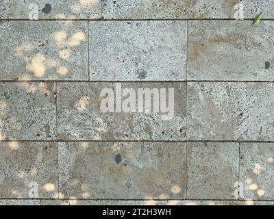 Gray marble rectangular tiles flooring pattern surface texture. Close-up of interior design decoration background. Stock Photo