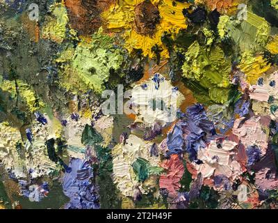 Close-up Textured background of multi-layer flaking paint on the wall. Mixing different colors of paints in the cleaved layers on the surface. Grunge Stock Photo