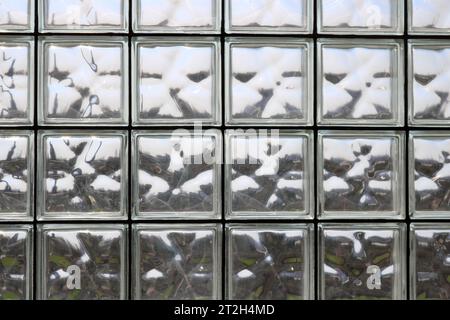 Texture of many shiny transparent beautiful square thick glass tiles with seams background Stock Photo