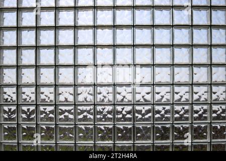 Texture of many shiny transparent beautiful square thick glass tiles with seams background Stock Photo