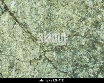 mountain texture. volumetric 3d background with a rock of stones and sand. rock with holes and burrows. solid stone, natural materials background. Stock Photo