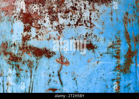 Texture of yellow rusty old shabby coarse rusty unique rust, oxidized metal, iron on blue peeling paint, background Stock Photo