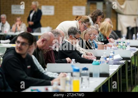 Ballot papers are checked and verified by count staff for the Tamworth by-election at The Rawlett School. Picture date: Thursday October 19, 2023. Stock Photo