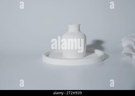 Small white ceramic vase.handmade symbolic ceramic figurines Stock Photo