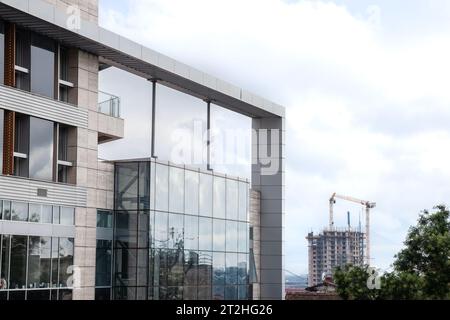 Picture of two buildings in a construction site, office space buildings under construction with cranes. Stock Photo