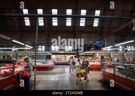 Picture of the main aisle of the butcher pavilion of Riga Central Market. Riga Central Market is Europe's largest market and bazaar in Riga, Latvia. Stock Photo