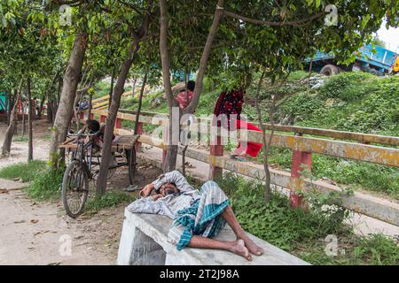 Gabtoli Amen Bazar is a bustling traditional boat station in Dhaka, Bangladesh, image captured on May 29, 2022. Boats line the tranquil waters of the Stock Photo