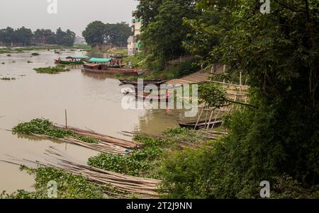 Gabtoli Amen Bazar is a bustling traditional boat station in Dhaka, Bangladesh, image captured on May 29, 2022. Boats line the tranquil waters of the Stock Photo