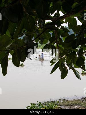 Gabtoli Amen Bazar is a bustling traditional boat station in Dhaka, Bangladesh, image captured on May 29, 2022. Boats line the tranquil waters of the Stock Photo