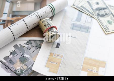 Drawings, layout of the house, documents, calculator on the desktop in the office. Engineering, construction, business. Stock Photo