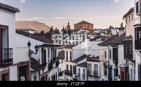 Views of the medieval village of Ronda with white Andalusian houses and the gothic style church of Santuario de Mar a Auxiliadora. Malaga, Spain Stock Photo