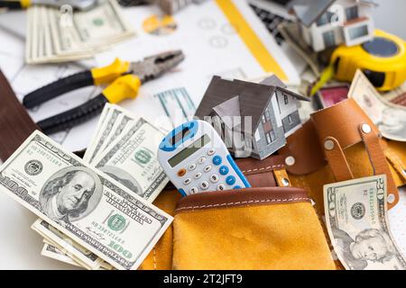 Working on construction project background. Office table with dollars and pen Stock Photo