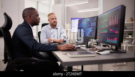 African American Data Analyst Using Data Analytics KPI Dashboard Stock Photo