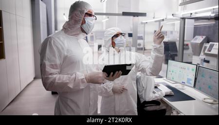 Factory Clean Room Laboratory. Industrial Engineer Using Technology Stock Photo