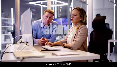 Analyst Working With Spreadsheet Business Data On Computer Stock Photo
