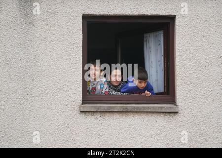 People look out of a window at flood water in Brechin, Scotland, as Storm Babet batters the country. Flood warnings are in place in Scotland, as well as parts of northern England and the Midlands. Thousands were left without power and facing flooding from 'unprecedented' amounts of rain in east Scotland, while Babet is set to spread into northern and eastern England on Friday. Picture date: Friday October 20, 2023. Stock Photo