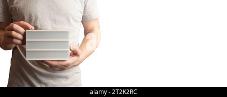 Man with gray t-shirt holds a customizable LED panel Stock Photo