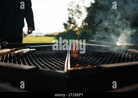 fire burning in a bbq at the beach in Sweden Stock Photo