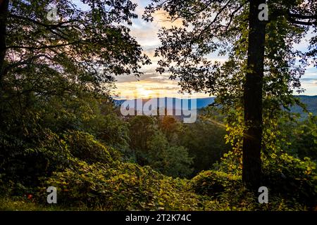 The Sun Sets Through the Clouds over the Blue Ridge Mountains Stock Photo