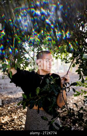 Portrait of Non Binary Person with Shaved Head in San Diego Stock Photo