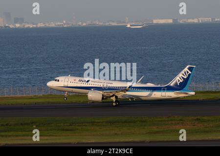 an ANA All Nippon Airways Airbus A320-200 with an ANK Boeing 737