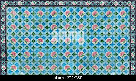 Rows of antique Nyonya Tiles with pink flowers. Vintage wall tile in penang. Stock Photo