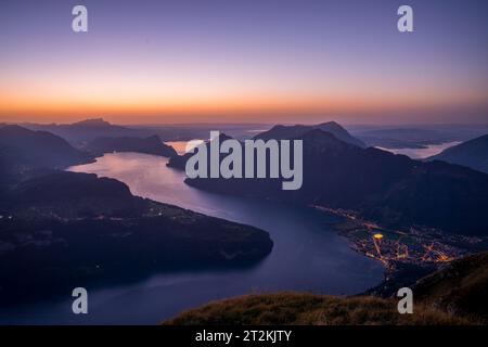 Lake Lucerne, Switzerland at Sunset from Fronalpstock with the town of Brunnen illuminated. Stock Photo