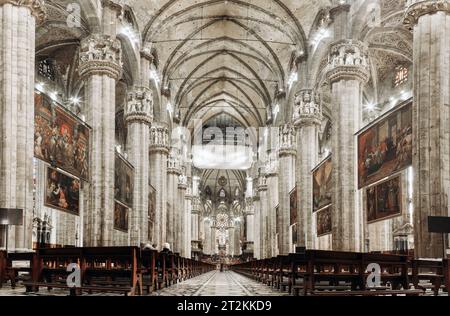 Inside the famous Duomo, the cathedral of Milan city, Italy, also known as Basilica of the Nativity of Saint Mary. Its construction began in 1386. Stock Photo