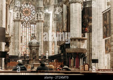 Inside the famous Duomo, the cathedral of Milan city, Italy, also known as Basilica of the Nativity of Saint Mary. Its construction began in 1386. Stock Photo