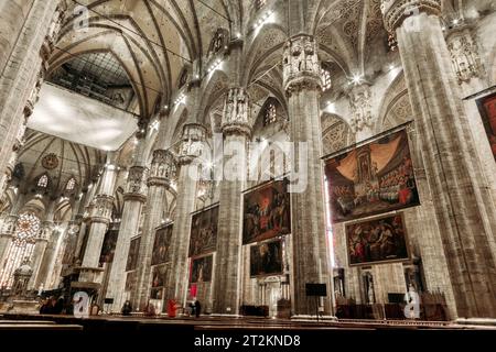 Inside the famous Duomo, the cathedral of Milan city, Italy, also known as Basilica of the Nativity of Saint Mary. Its construction began in 1386. Stock Photo