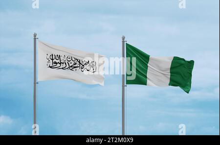 Nigeria and Afghanistan flags waving together on blue cloudy sky, two country relationship concept Stock Photo