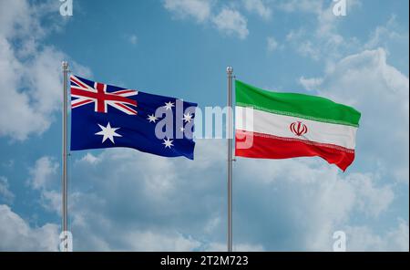 Iran and Australia flags waving together on blue cloudy sky Stock Photo