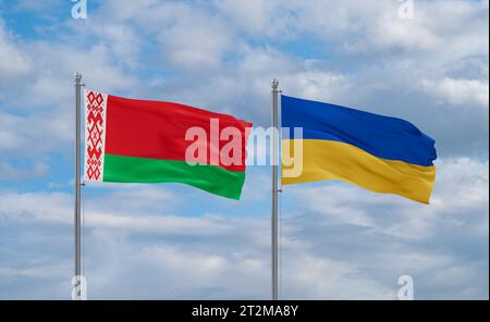 Ukraine and Belarus flags waving together in the wind on blue cloudy sky, two country relationship concept Stock Photo