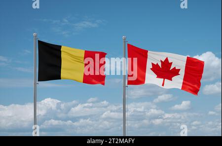 Canada and Belgium flags waving together in the wind on blue cloudy sky, two country relationship concept Stock Photo