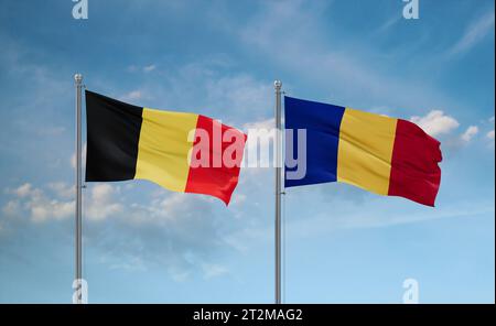 Republic of Chad and Belgium flags waving together in the wind on blue cloudy sky, two country relationship concept Stock Photo