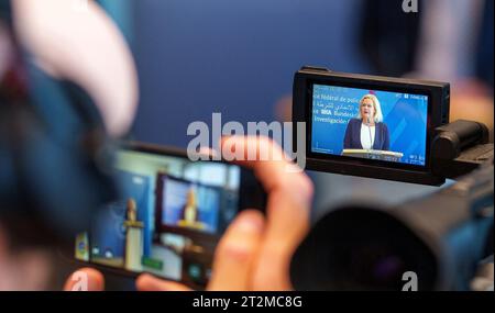 Wiesbaden, Germany. 20th Oct, 2023. Nancy Faeser (SPD), Federal Minister of the Interior, speaks at the Federal Criminal Police Office about the current security situation and can be seen in the display of a camera. Federal Minister of the Interior Faeser and BKA Vice President Peter have commented on the current security situation and the measures taken by the security authorities in Germany as a result of the Hamas terrorist attacks on Israel. Credit: Andreas Arnold/dpa/Alamy Live News Stock Photo