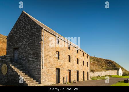 A sunny, autumnal HDR image of Dunbeath Harbour Warehouse and Ice house on the east coast of Caithness, Scotland. 17th October 2023 Stock Photo