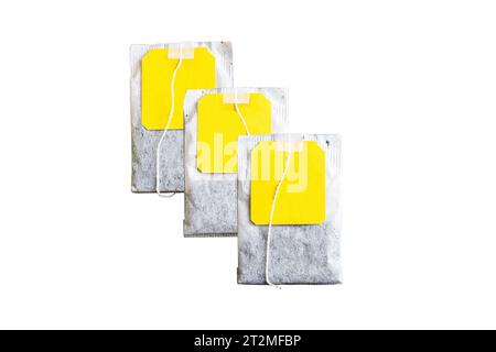 Tea bag with yellow label on a white background isolated Stock Photo